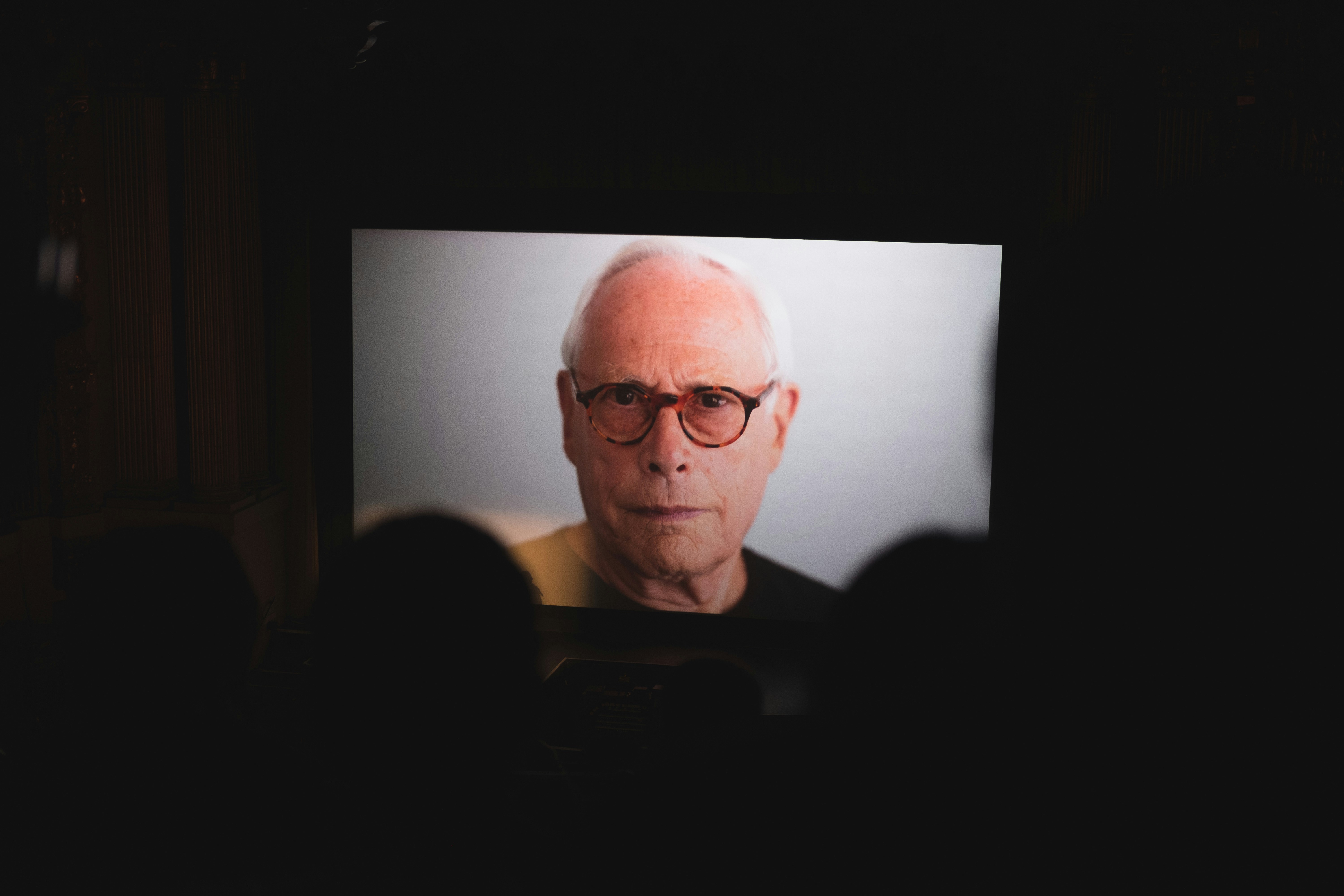 Dieter Rams An image of Dieter Rams projected on a wall